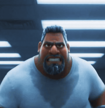 A heavyset man grinding through a workout at the gym