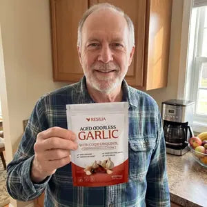 Resilia customer holding the Aged Garlic pouch