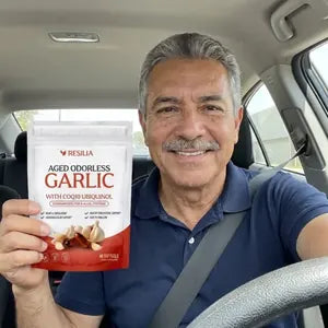 Resilia customer holding the Aged Garlic pouch