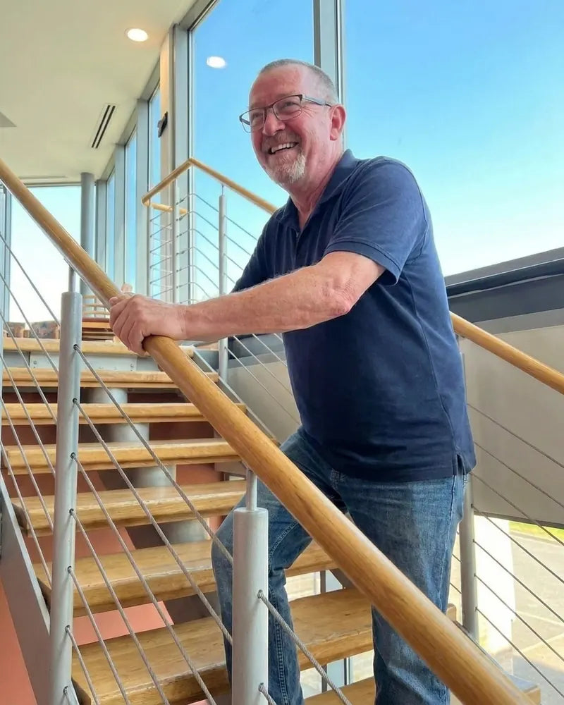 The same man walking up the stairs with ease